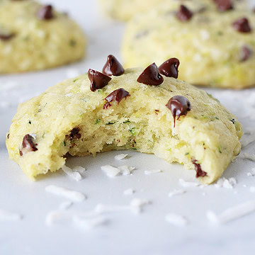 Photo of a zucchini cookie topped with chocolate chips with a bite taken out.