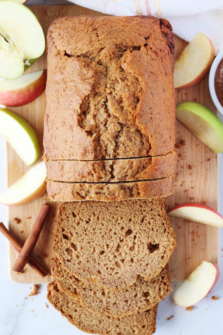 Overhead photo of a loaf of apple butter bread with half sliced.