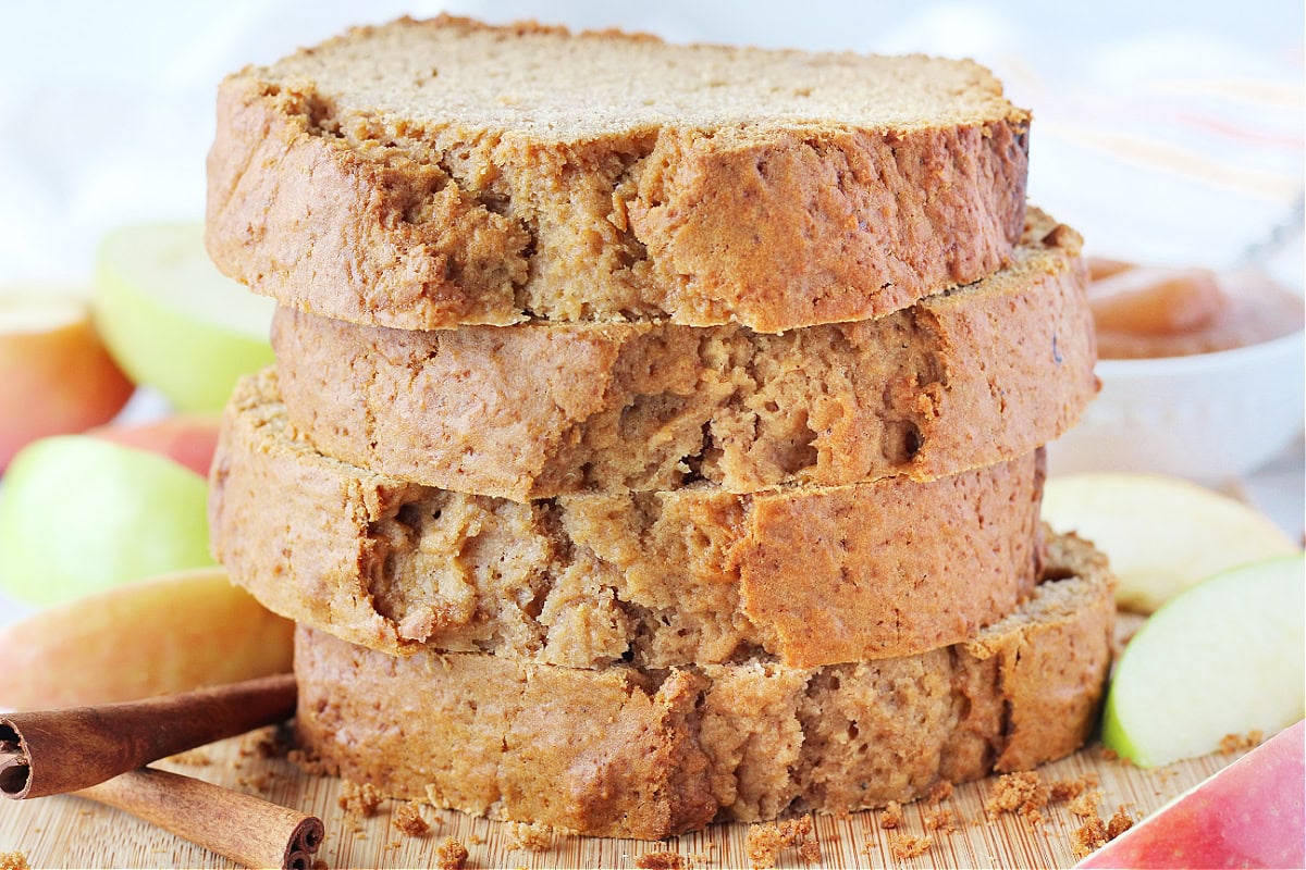 Up close photo of four stacked slices of low sugar apple butter bread.