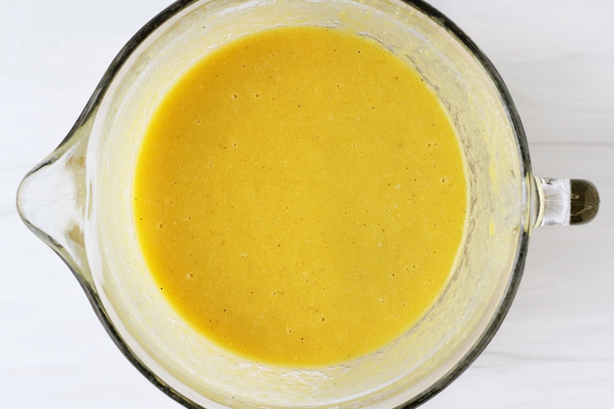 Overhead photo of an egg mixture in a glass bowl.