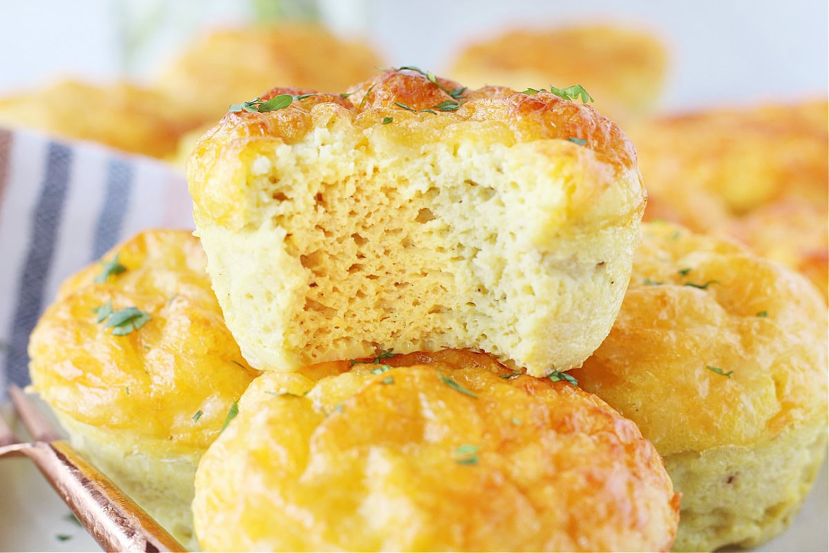 Up close photo of an egg muffin with a bite taken out of it.