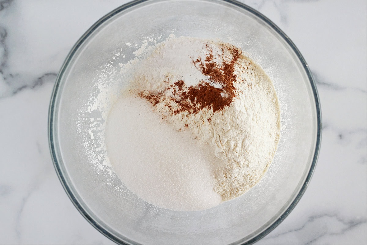 Flour, monk fruit sweetener, and spices in a glass bowl.