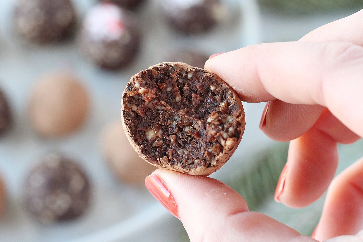 A bite taken out of no bake chocolate mint ball.