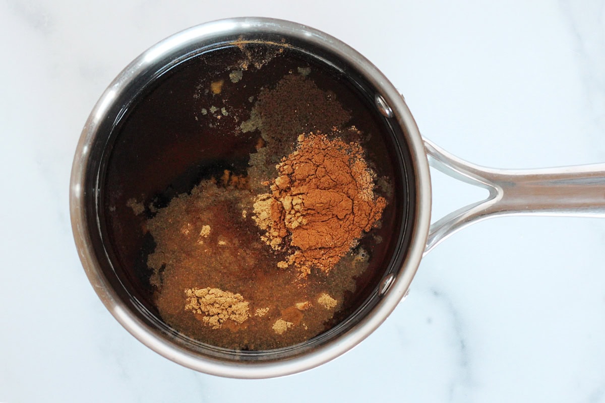 Ground spices in water, molasses, and brown sugar in a small soup pot.