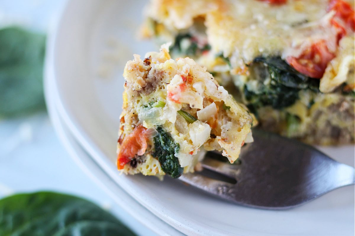 Up close photo of turkey sausage breakfast casserole on a fork.