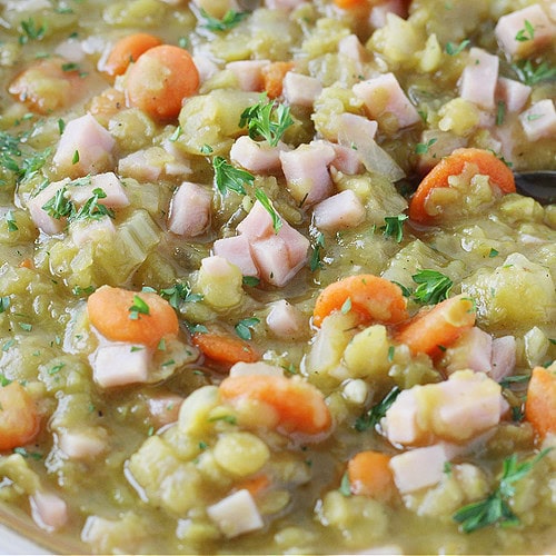 Up close photo of the best split pea soup with ham in a bowl.