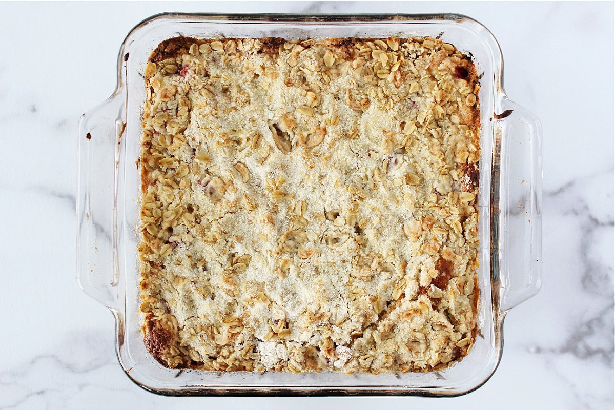 Blueberry coffee cake baked in a glass 8x8 pan.