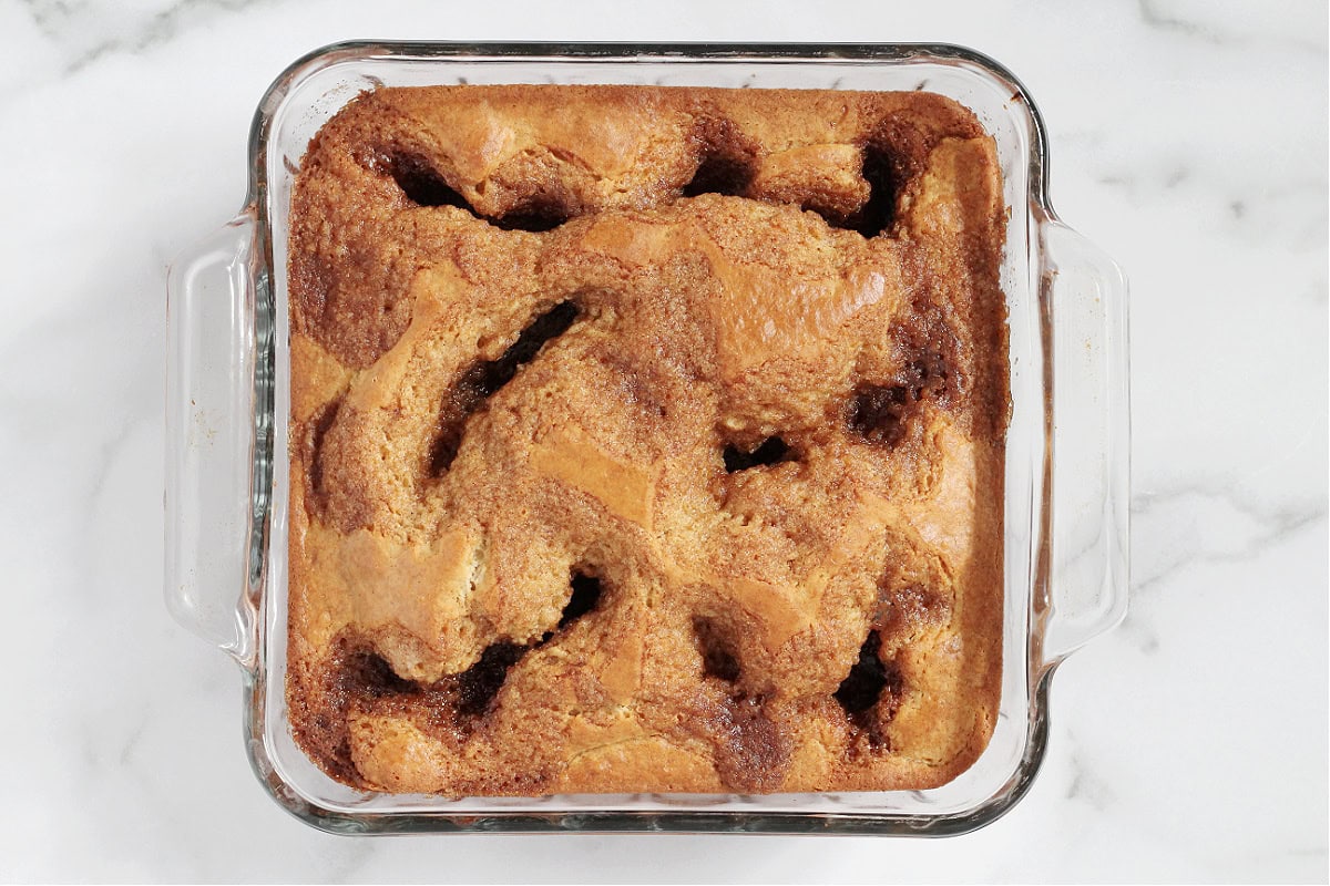 Baked cowboy bread in a glass 8x8 pan.