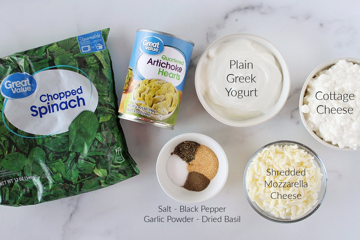 Labeled ingredients for hot spinach and artichoke dip with Greek yogurt.