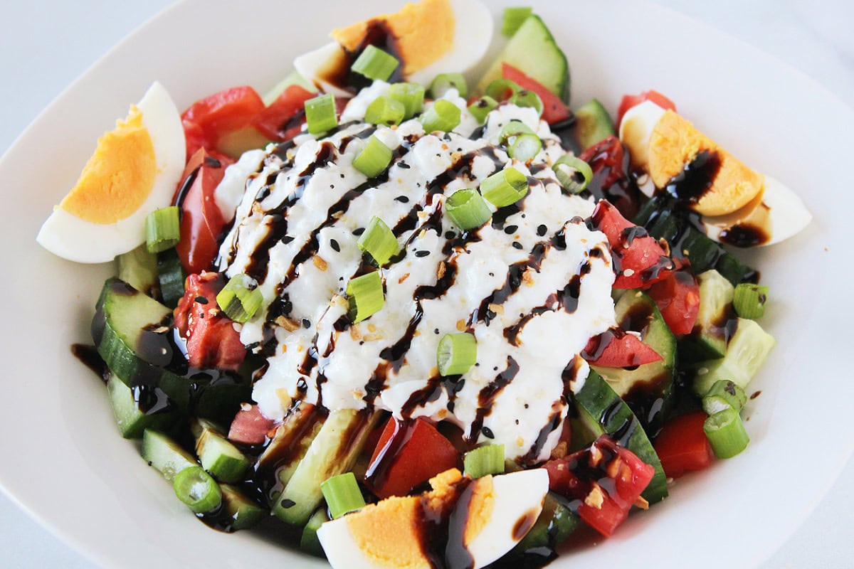 Green onion and a drizzle of balsamic glaze over veggies and hard boiled eggs.