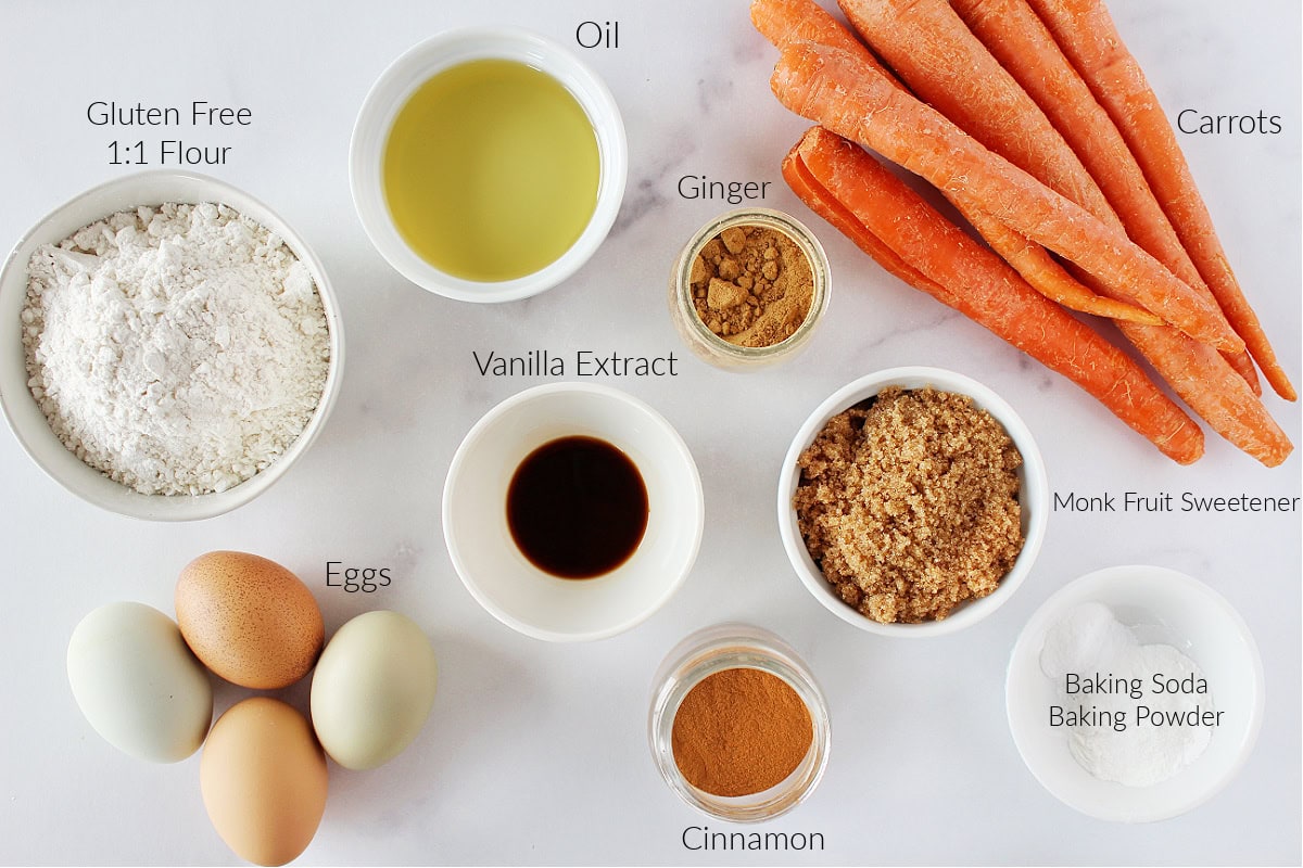 Labeled ingredients for single serve carrot cake jars on a white marble countertop.