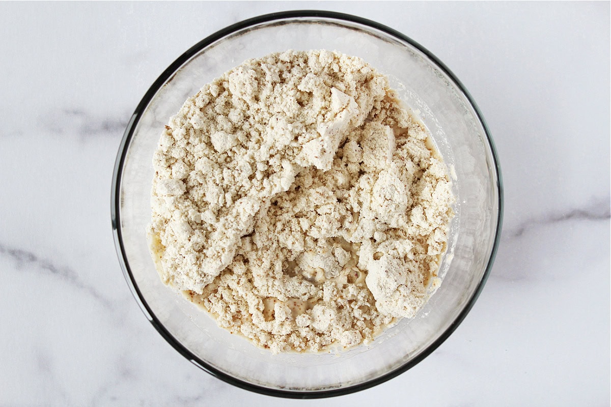 Protein powder baking mix in a glass bowl with water.