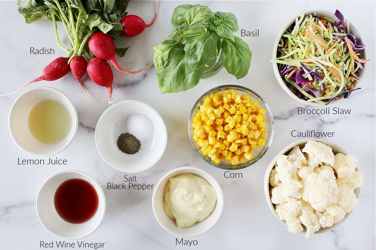 Labeled ingredients for cauliflower and broccoli slaw salad.
