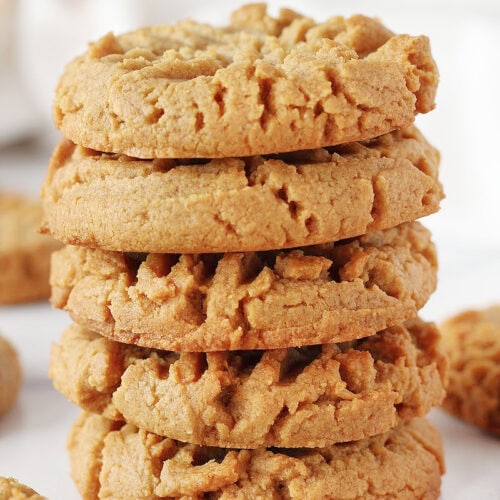 Five peanut butter cookies stacked on top of each other.
