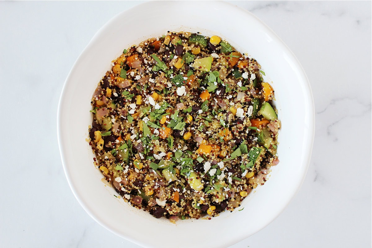 Cotija cheese and cilantro on a southwest quinoa salad with black beans.