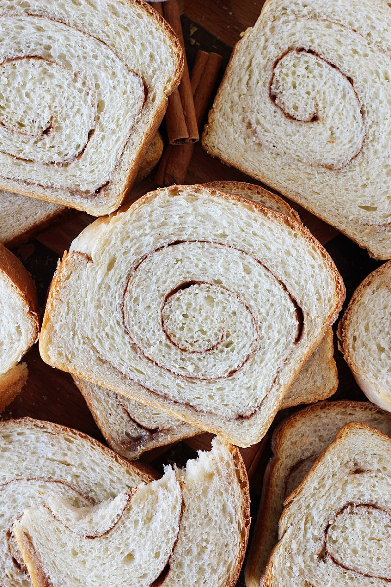 Cinnamon swirl sourdough bread slices sitting atop eachother.