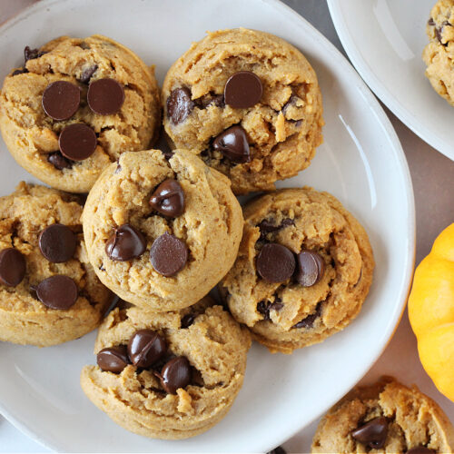 Pumpkin chocolate chip cookies on a plate.