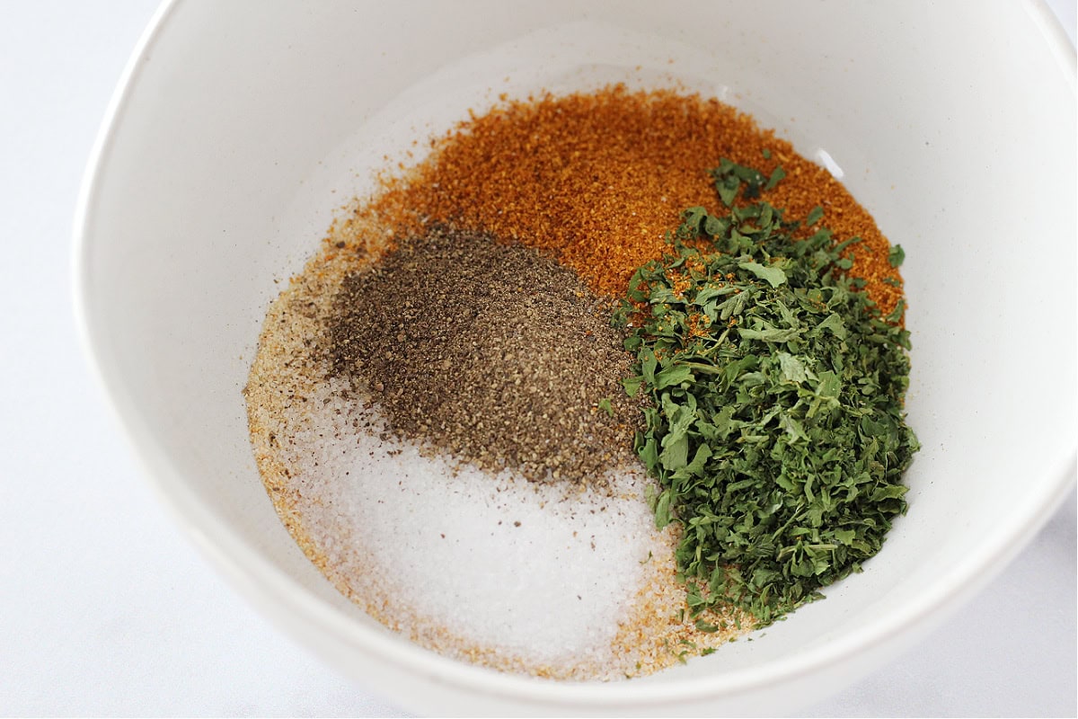 Dried seasonings in a white bowl.