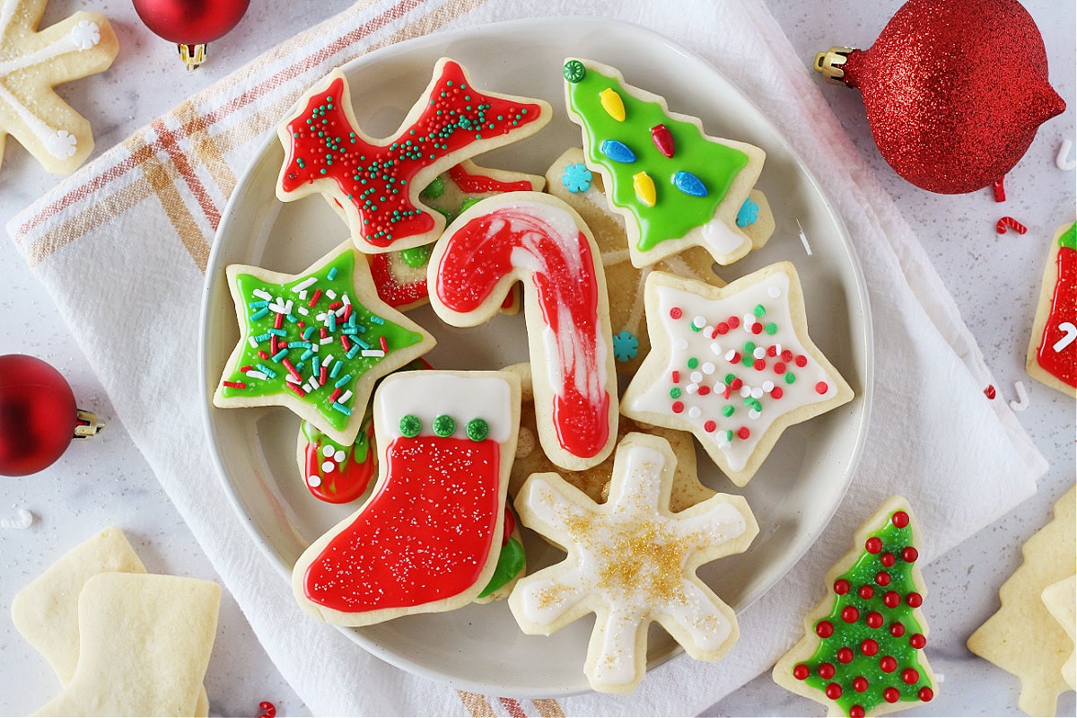Candy cane, tree, reindeer, stars, snowflake and stocking decorated sugar cookies.