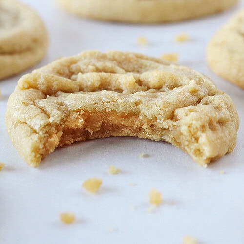 A bite taken out of a brown butter cookie.