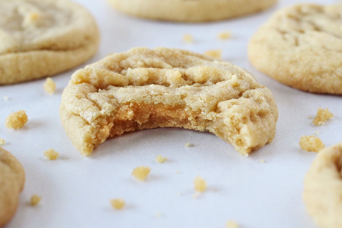A bite taken out of a brown butter cookie.