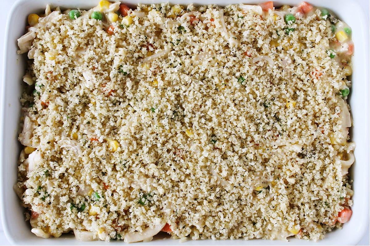 Panko breadcrumb topping on chicken noodle casserole in a 9x13 pan.