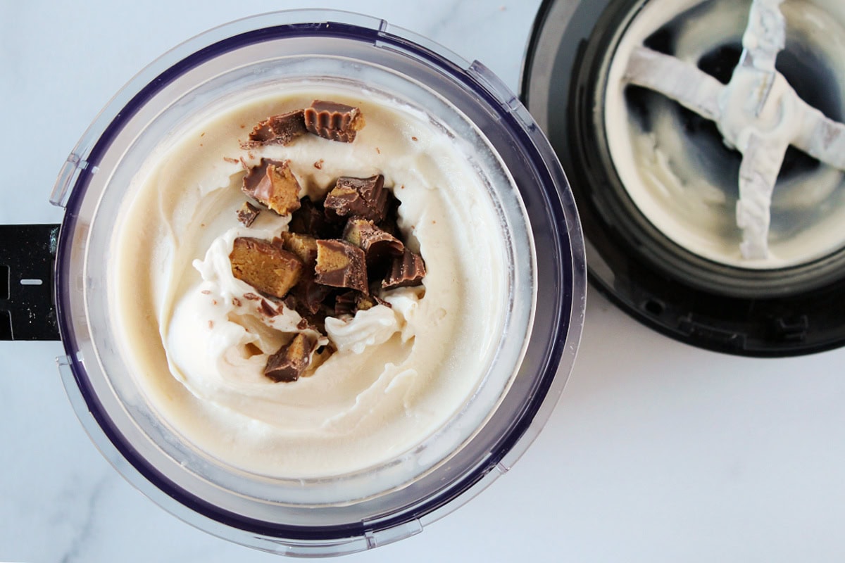 Chopped peanut butter cups placed in the center of Ninja Creami ice cream.