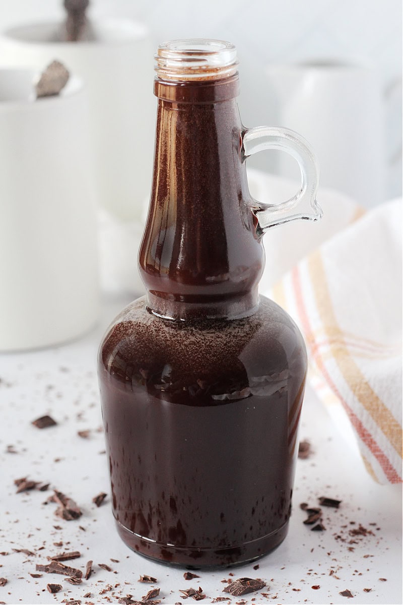 A glass bottle filled with homemade mocha coffee syrup.
