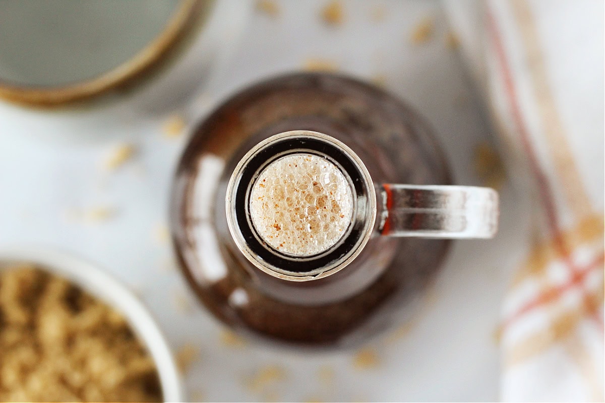 The top of a glass bottle filled with cinnamon brown sugar coffee syrup.