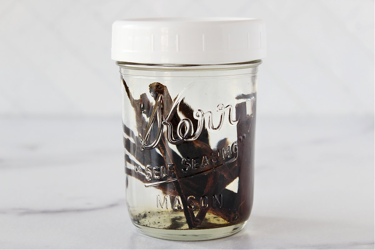 Vanilla beans in a mason jar of vodka.
