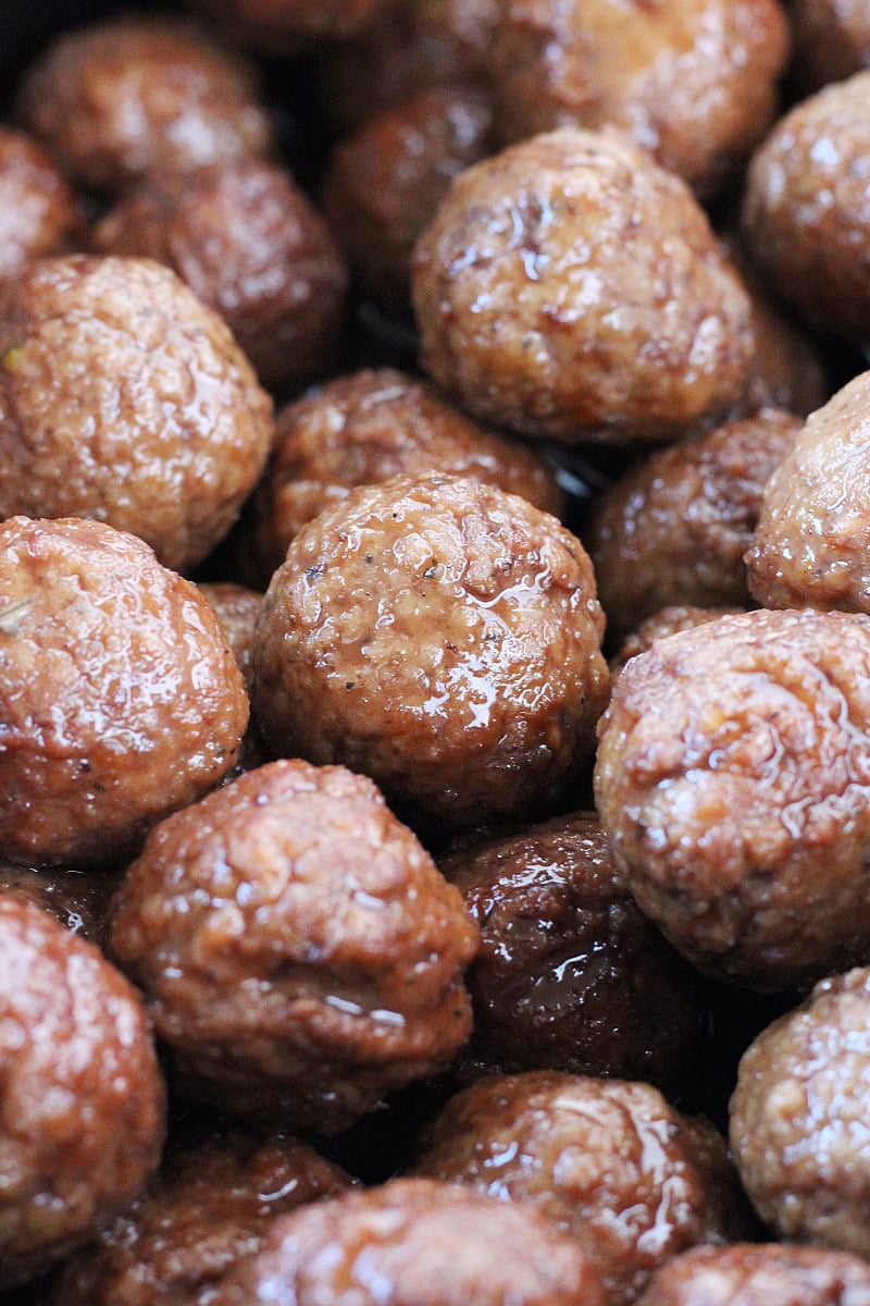 Cooked turkey meatballs in a raspberry balsamic sauce.