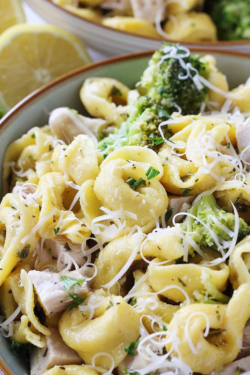 Chicken tortellini topped with shredded Parmesan and fresh parsley.